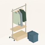 Isometric freestanding closet organizer with a garment rail, shelves, and fabric bins standing against a wall, a no-drill closet organization system for renters