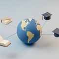 Isometric globe surrounded by small floating book and graduation-cap icons