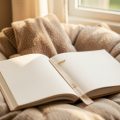 An open children's picture book with a bookmark resting on a cushion by a sunlit window